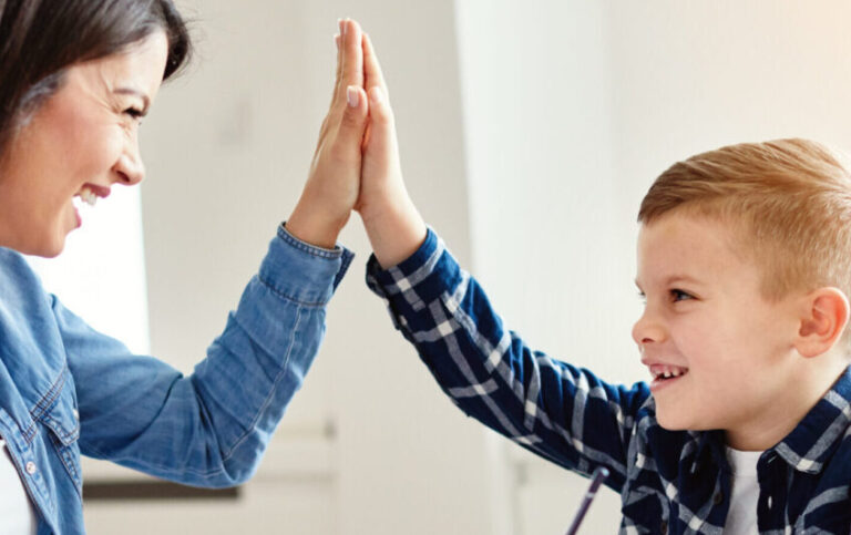 parent high fiving a student